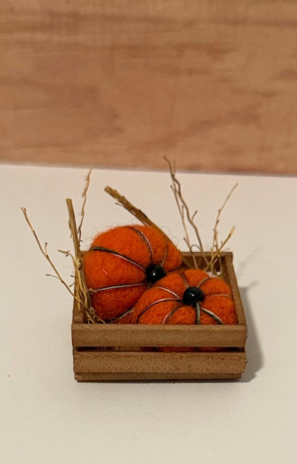 miniature pumpkins in wood crate- about  1 1/2” in length