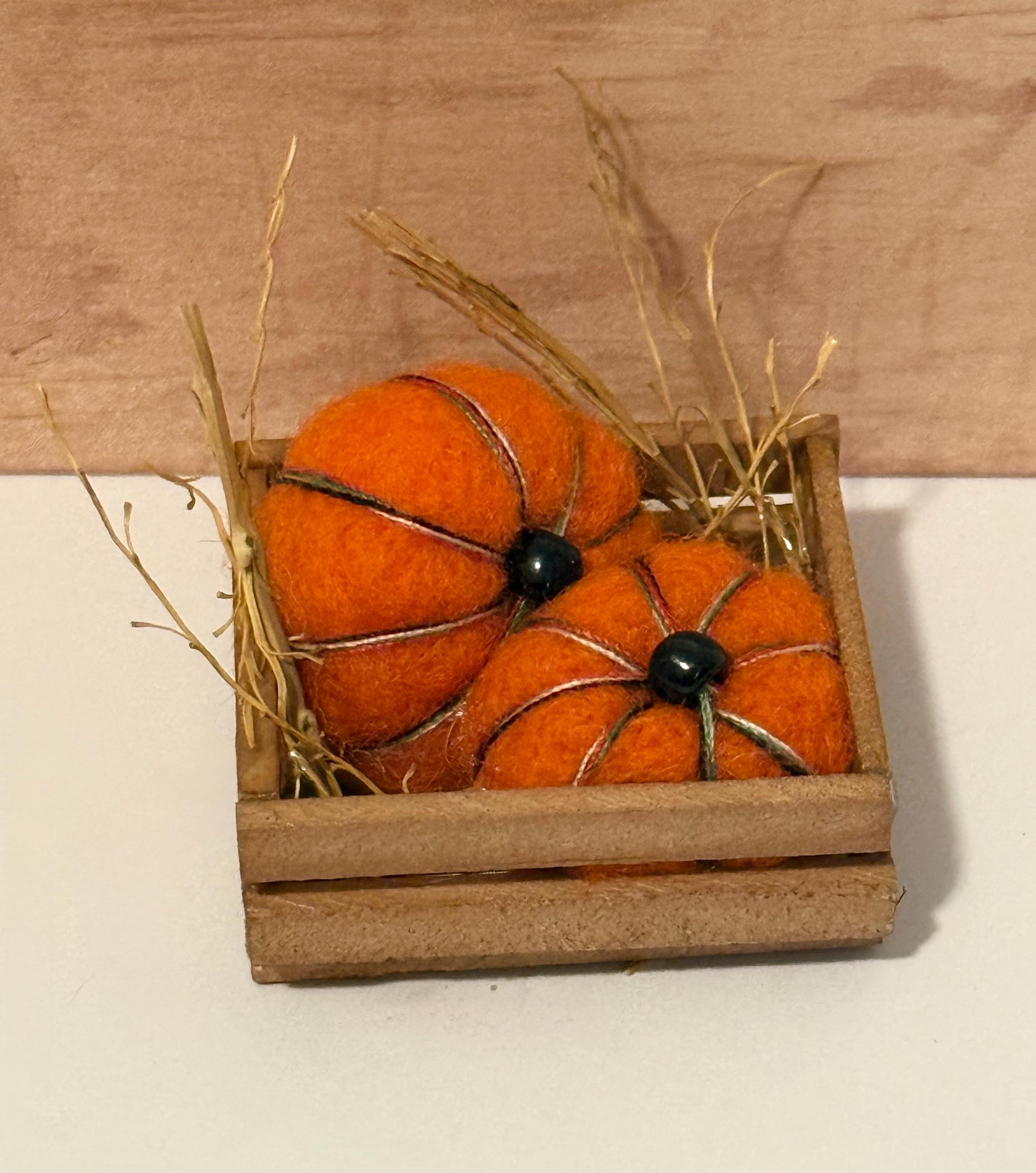 miniature pumpkins in wood crate- about  1 1/2” in length