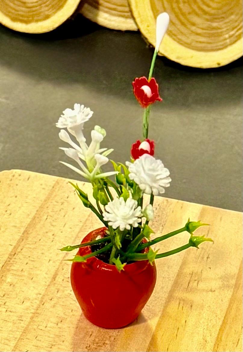 Miniature plant with Flower in terracotta pot