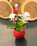 Miniature plant with Flower in terracotta pot