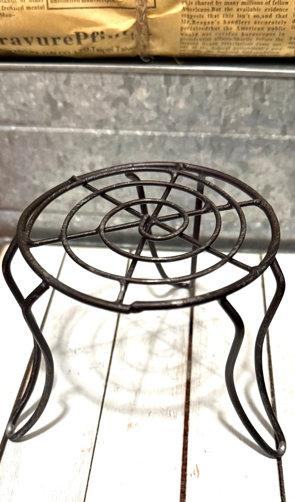 Miniature black metal round garden table