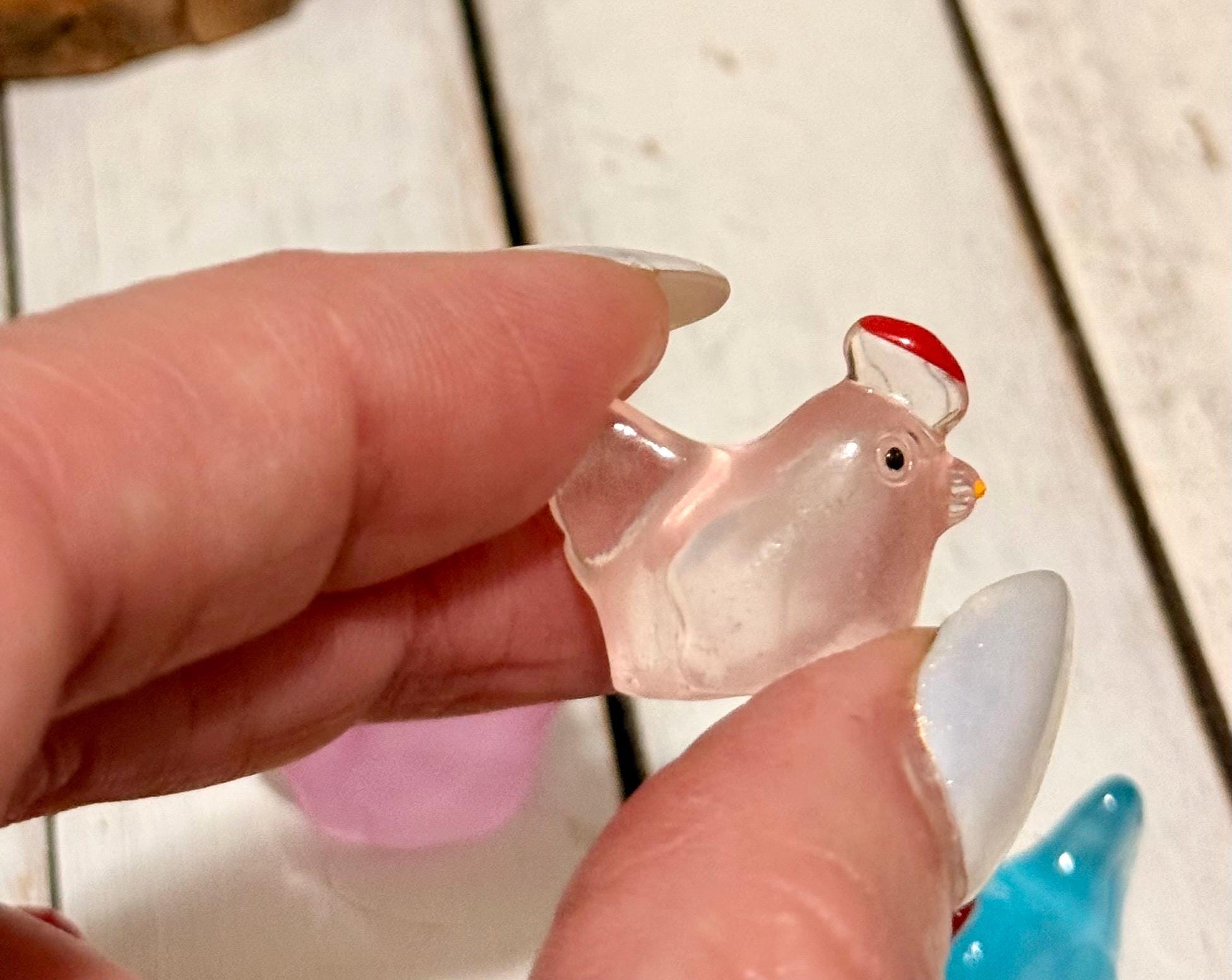 Miniature colorful hen figurines