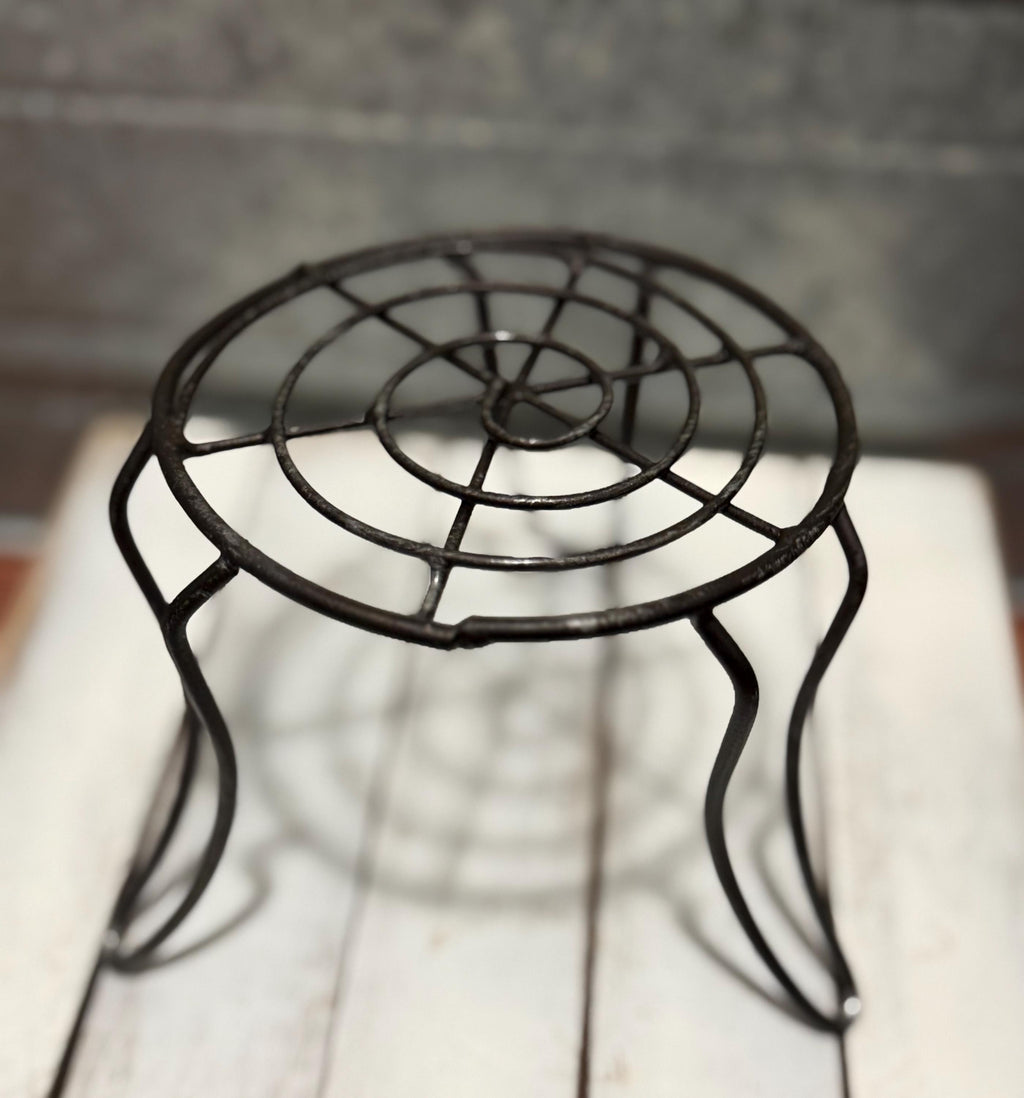 Miniature black metal round garden table