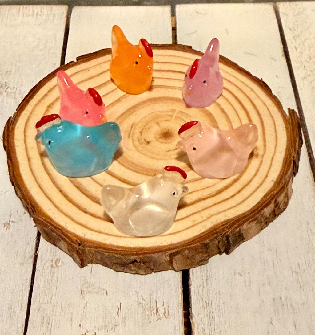 Miniature colorful hen figurines