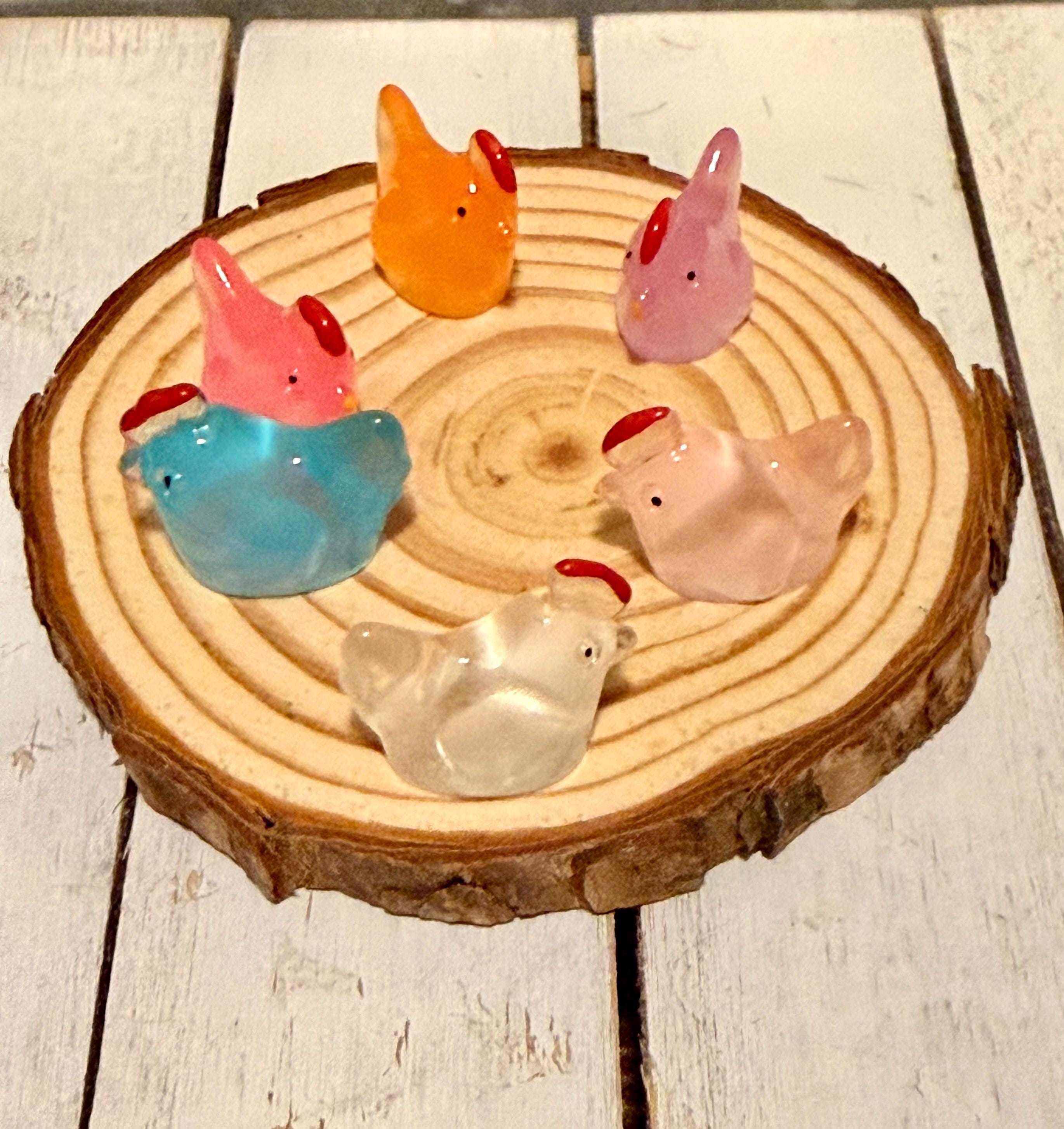 Miniature colorful hen figurines