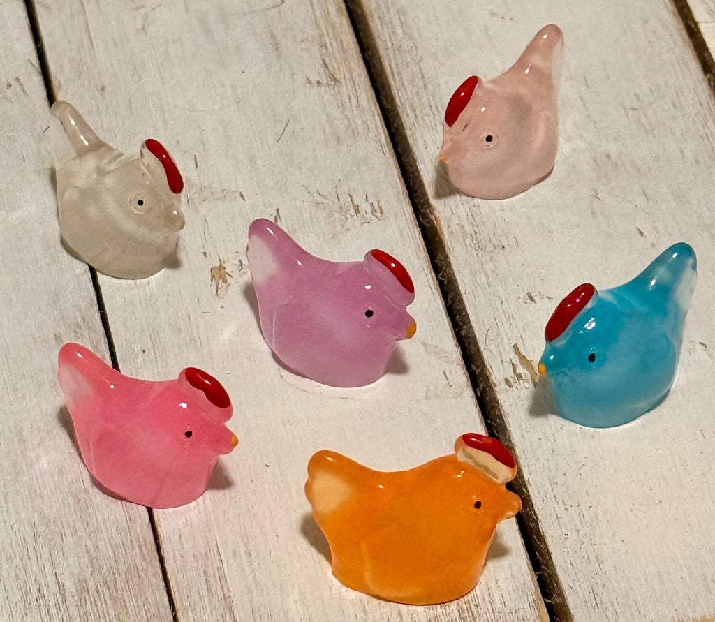 Miniature colorful hen figurines