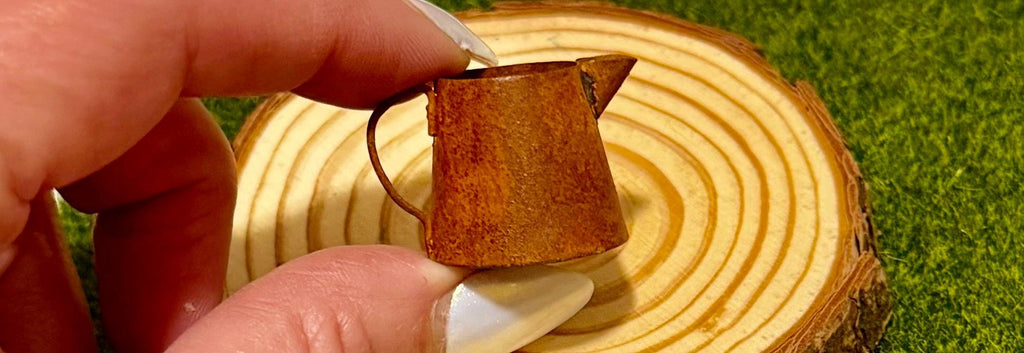 miniature metal rustic water can