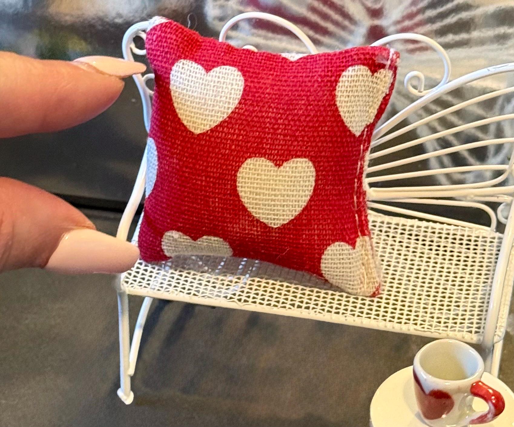 Miniature heart shaped dollhouse throw pillow.