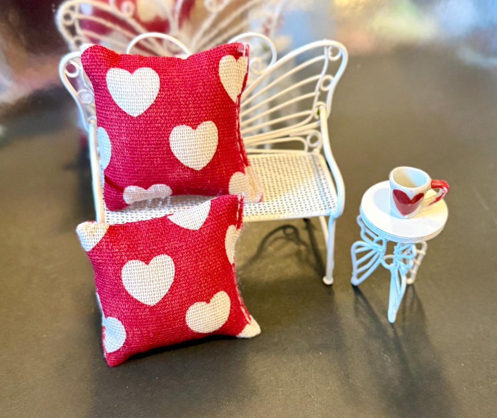 Miniature heart shaped dollhouse throw pillow.