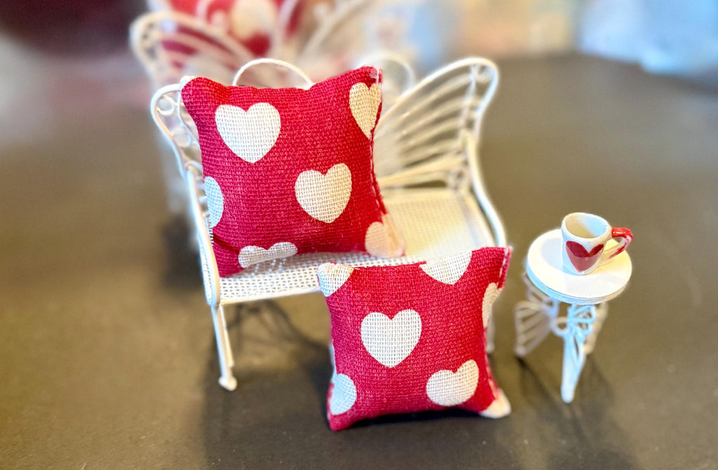 Miniature heart shaped dollhouse throw pillow.