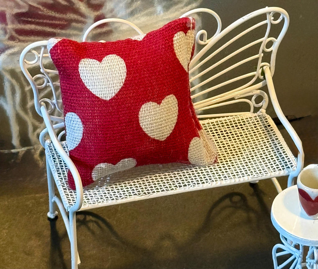 Miniature heart shaped dollhouse throw pillow.