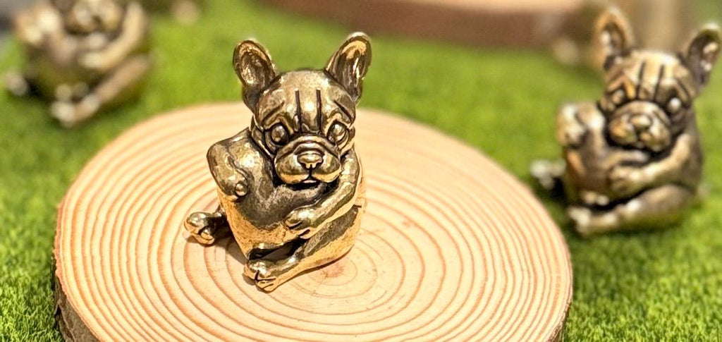 Miniature brass vintage Dog holding a heart figurine
