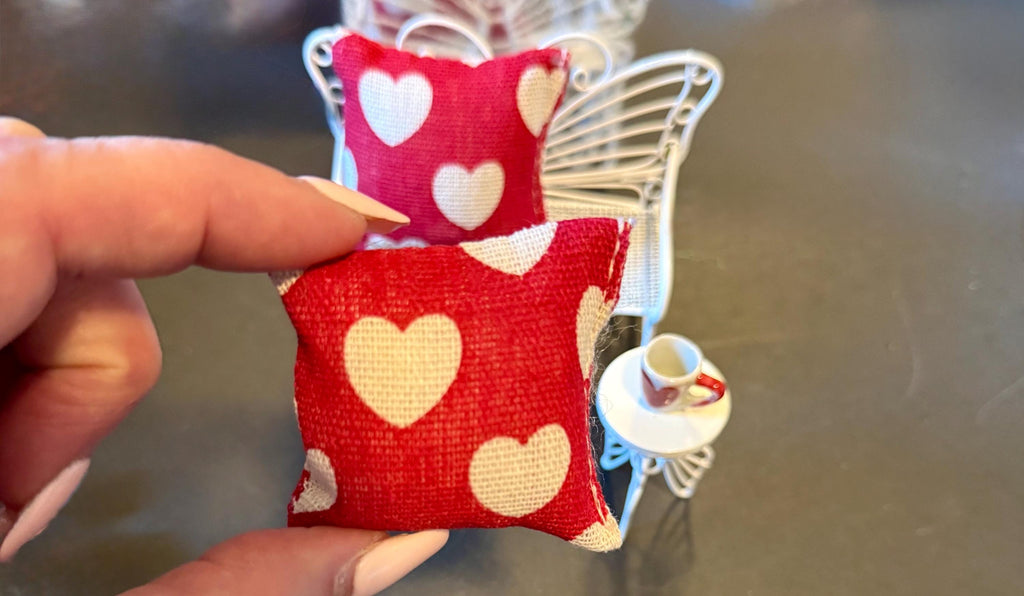 Miniature heart shaped dollhouse throw pillow.