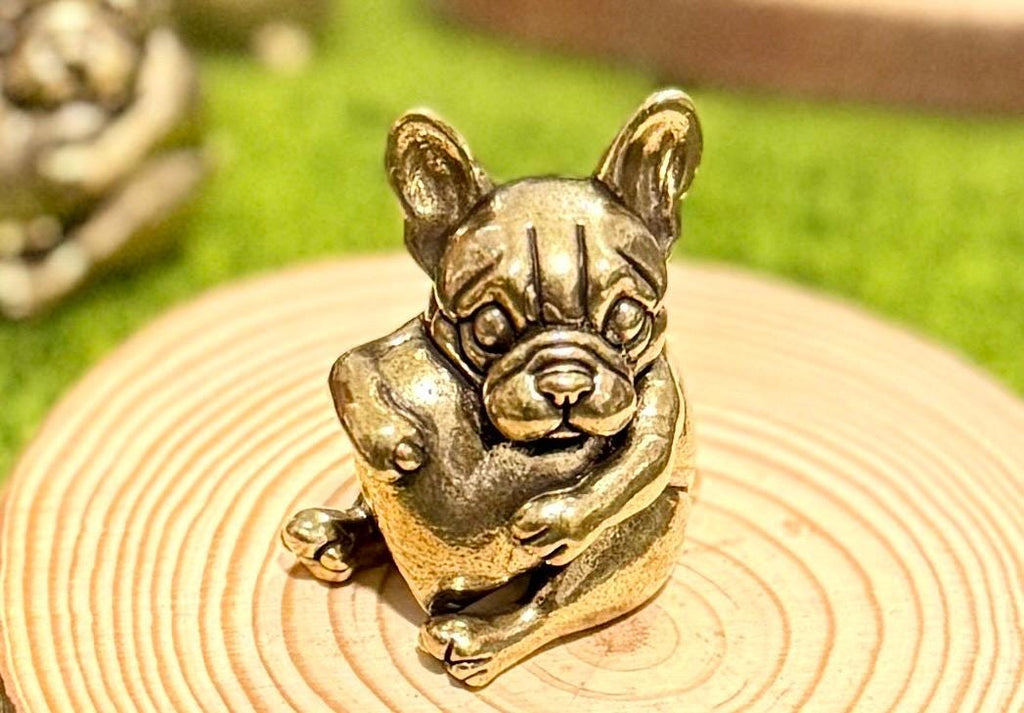 Miniature brass vintage Dog holding a heart figurine