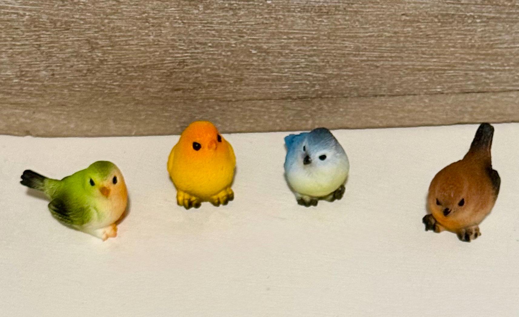 Miniature colorful bird figurines