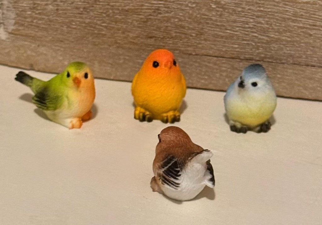 Miniature colorful bird figurines