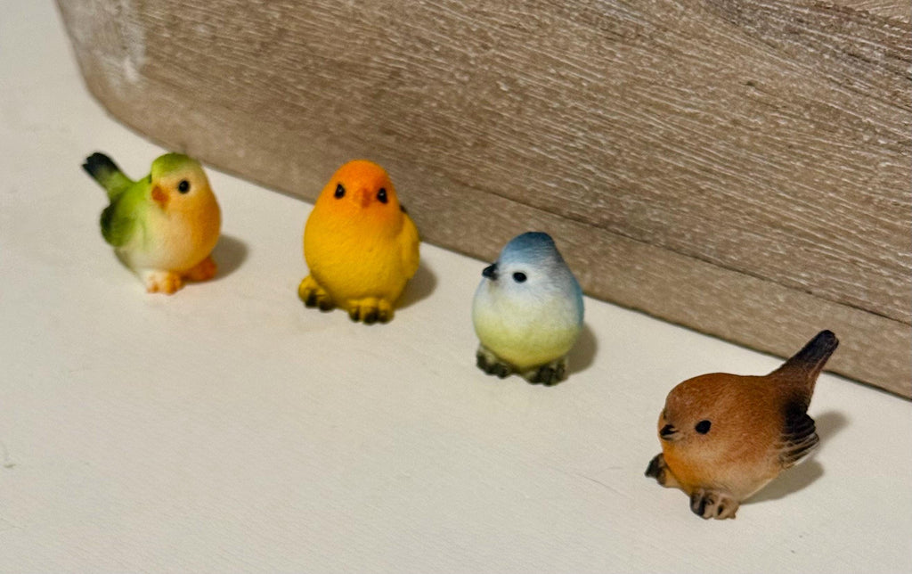 Miniature colorful bird figurines