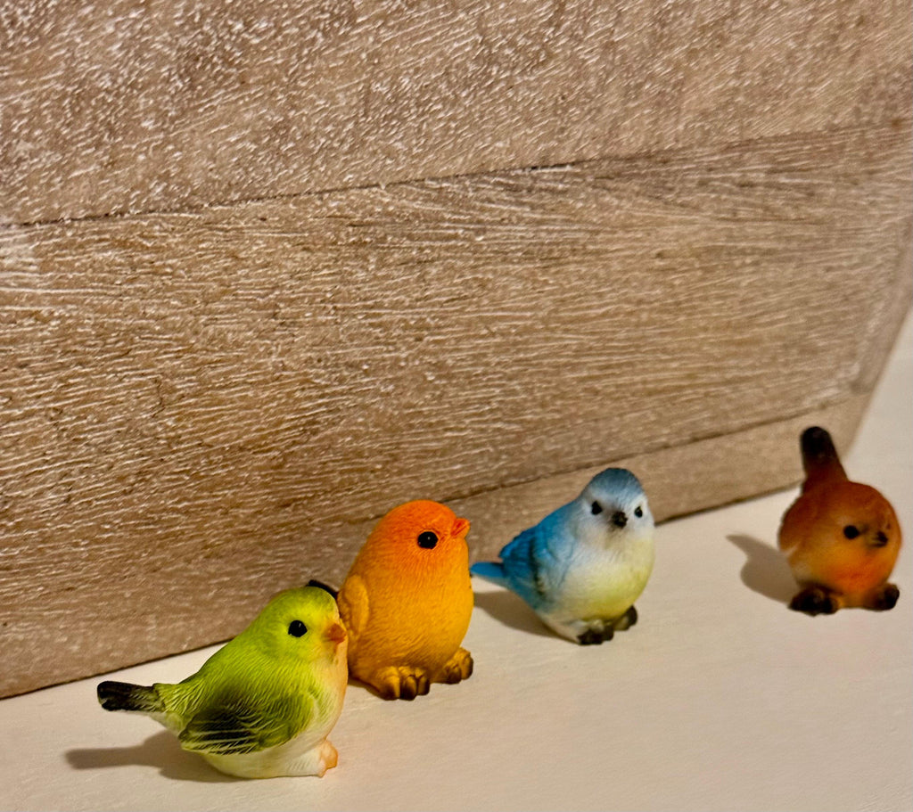 Miniature colorful bird figurines