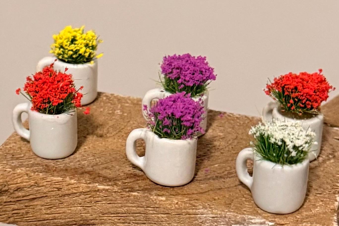Miniature ceramic coffee mugs with plants
