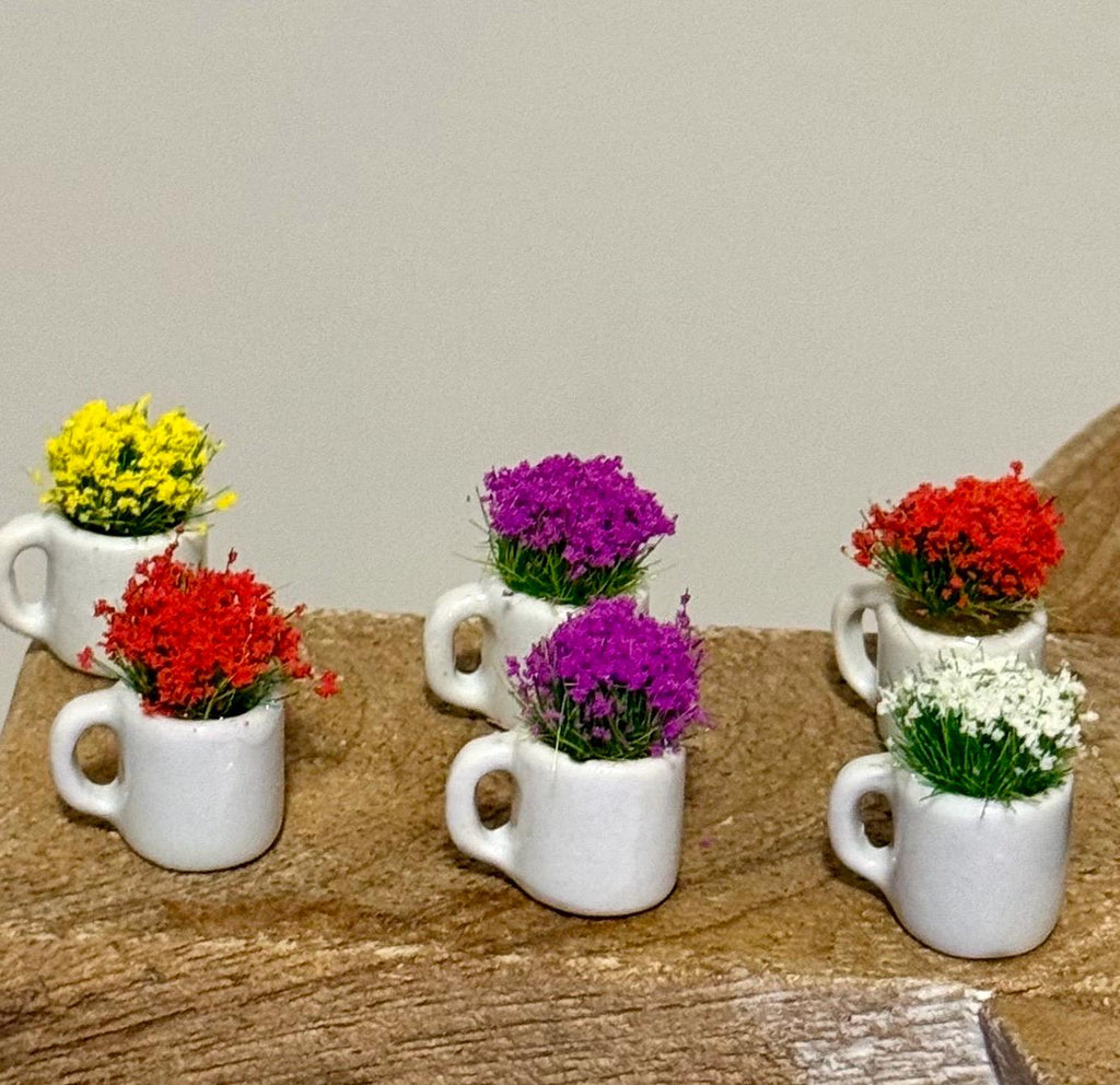 Miniature ceramic coffee mugs with plants