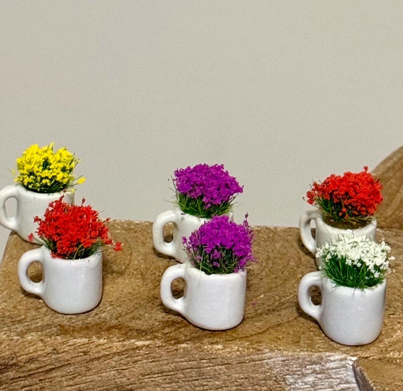 Miniature ceramic coffee mugs with plants