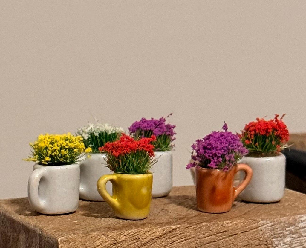 Miniature ceramic coffee mugs with plants