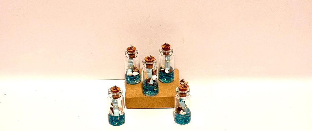 Miniature ocean theme message in a bottle