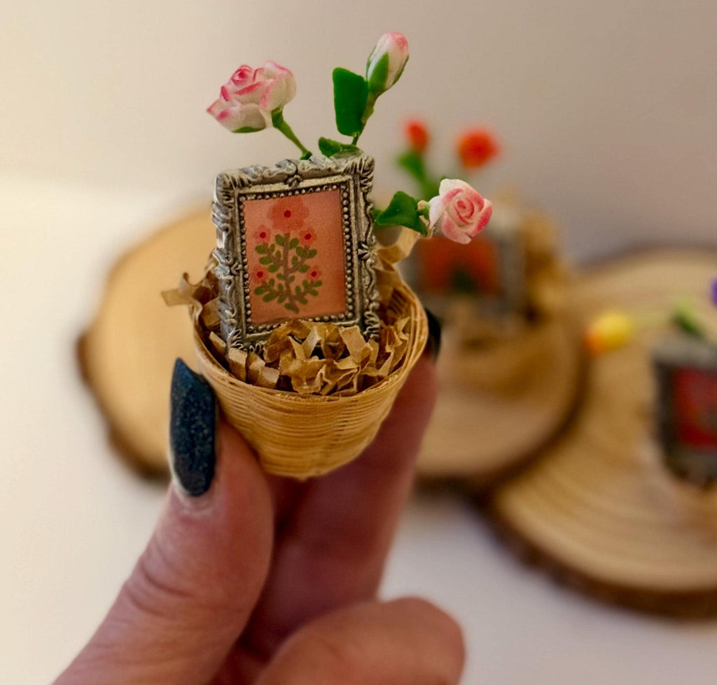 Miniature flowers and floral art frame in basket