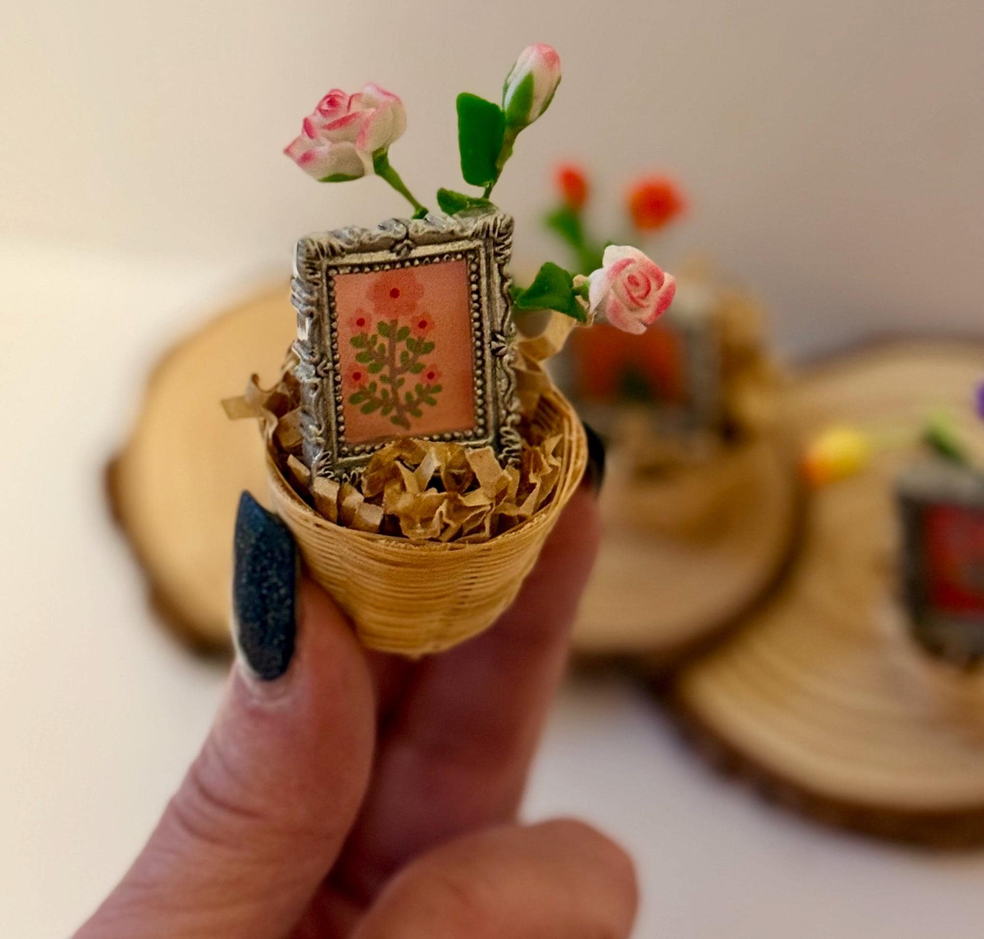 Miniature flowers and floral art frame in basket