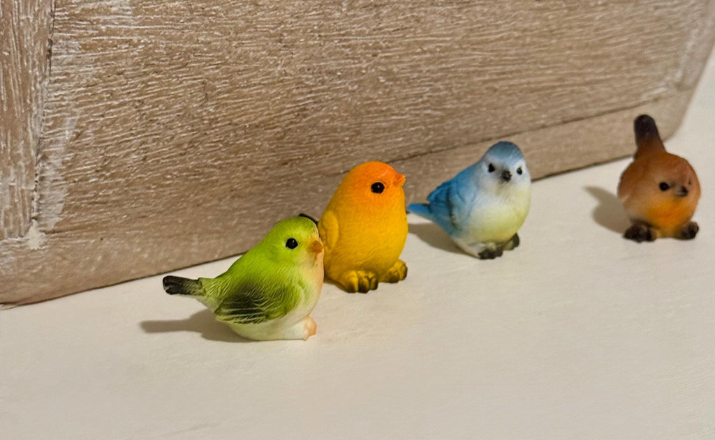 Miniature colorful bird figurines