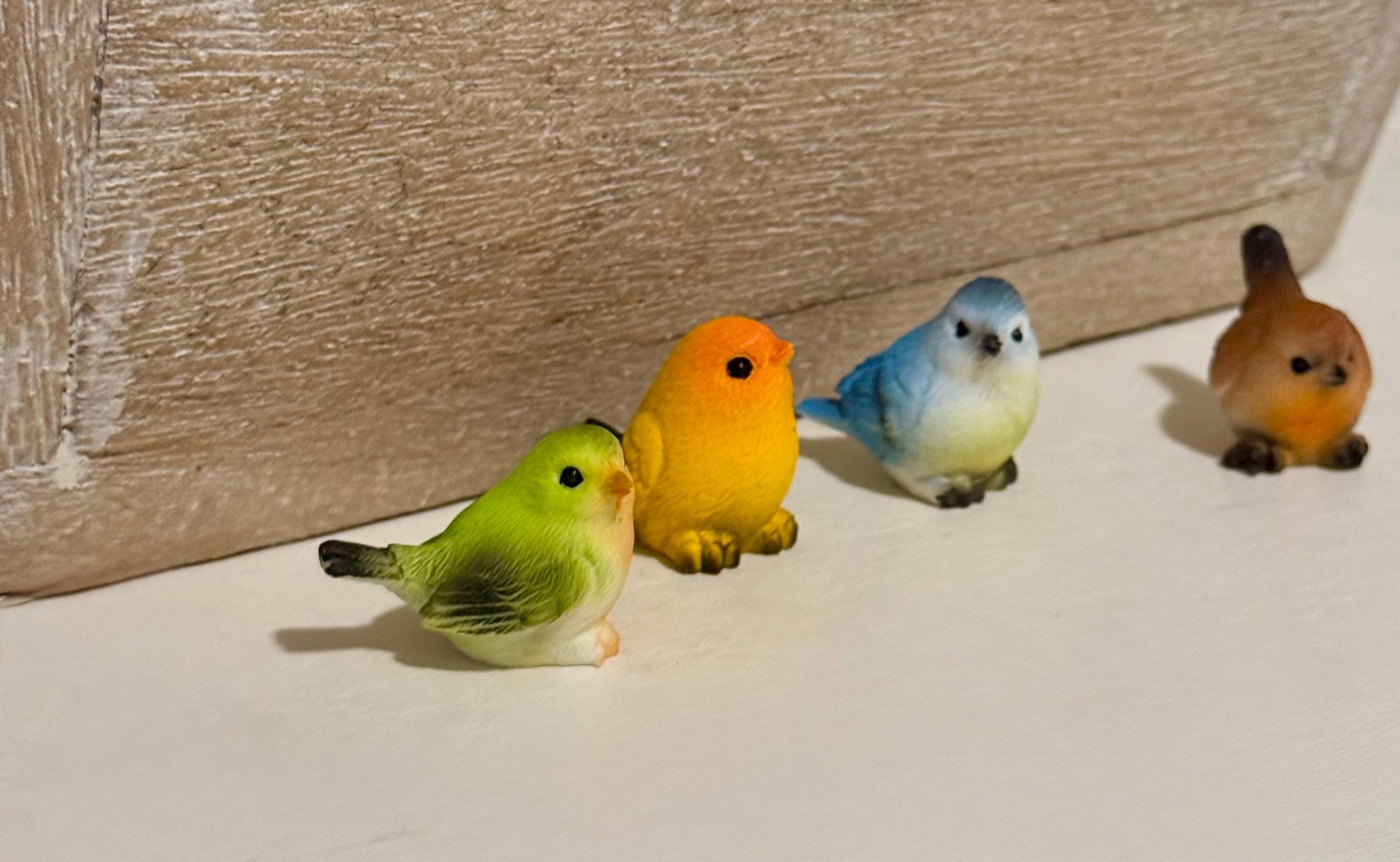 Miniature colorful bird figurines