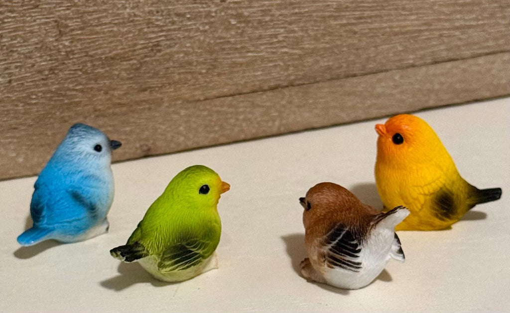 Miniature colorful bird figurines
