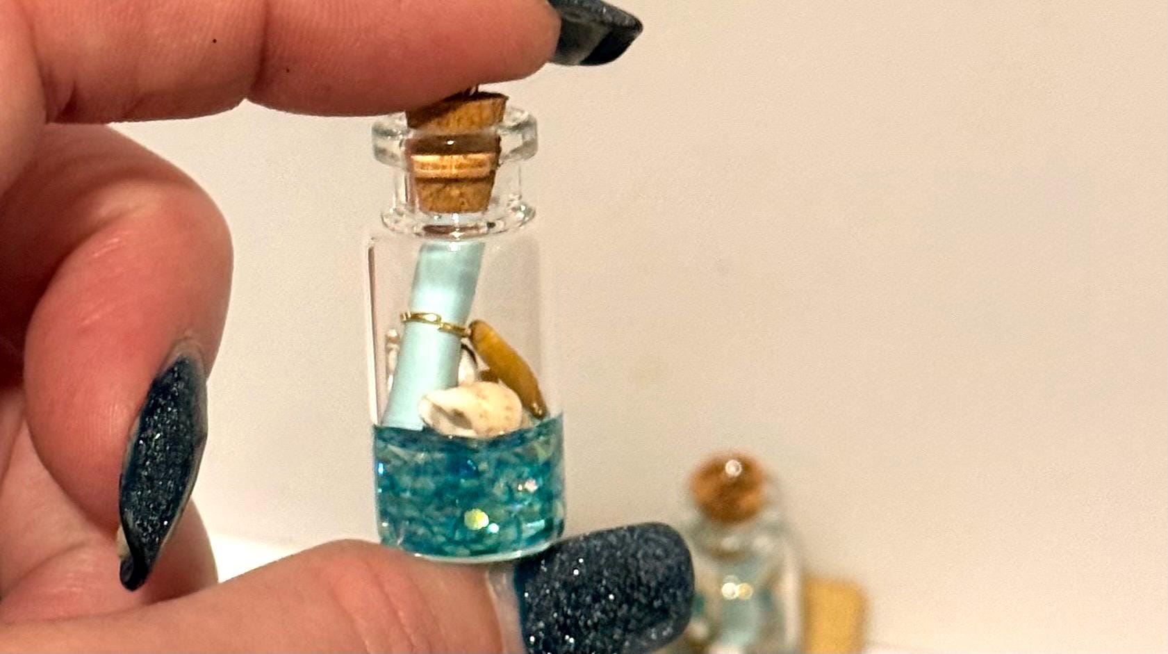 Miniature ocean theme message in a bottle