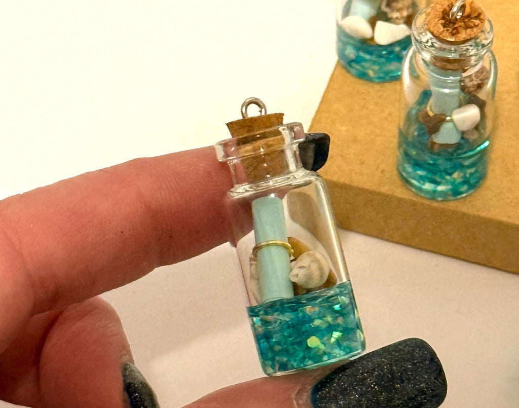 Miniature ocean theme message in a bottle