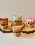 Miniature basket filled with a mini throw pillow and strawberries