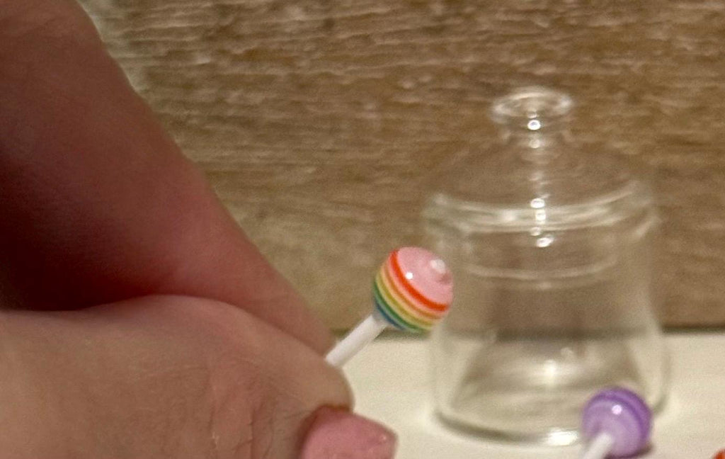 Miniature glass candy jar filled with lollipops. 1:12 scale.