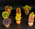 Miniature Fall Foliage Flowering Plant with pumpkins and bats