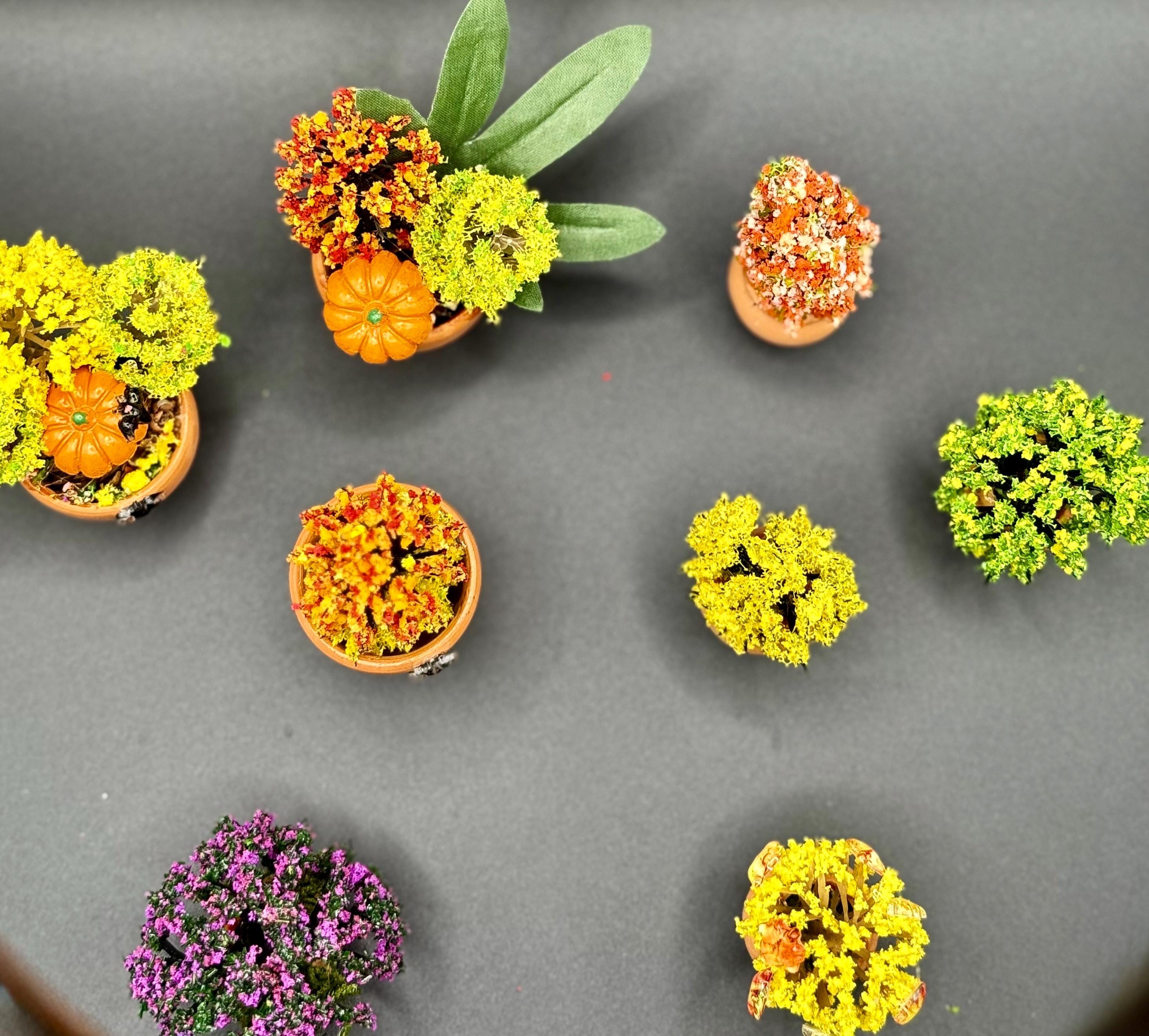 Miniature Fall Foliage Flowering Plant with pumpkins and bats