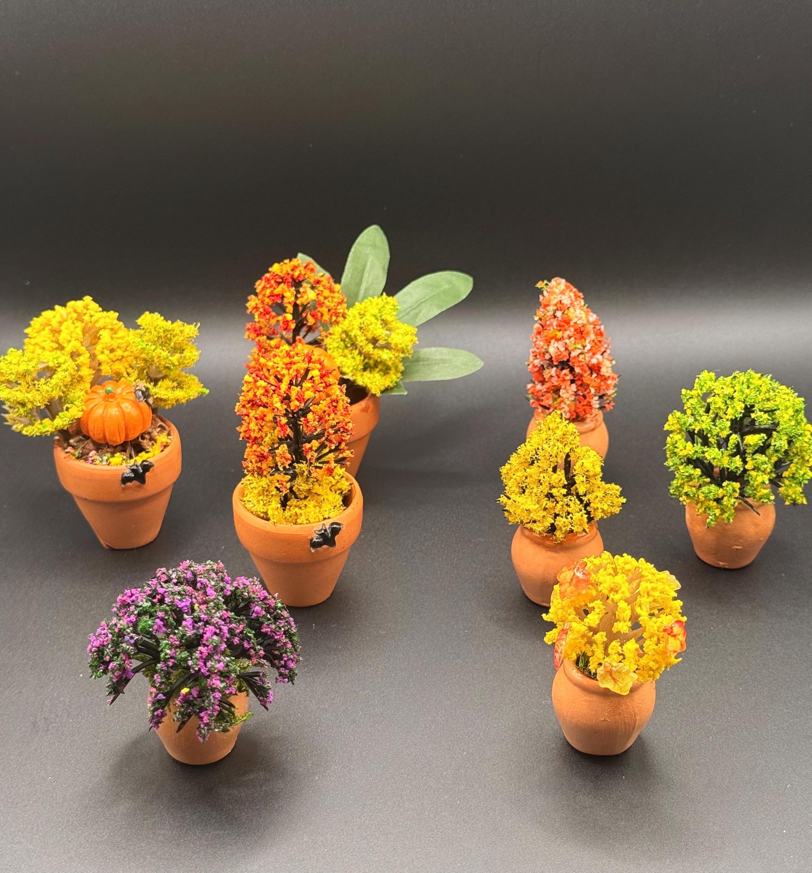 Miniature Fall Foliage Flowering Plant with pumpkins and bats