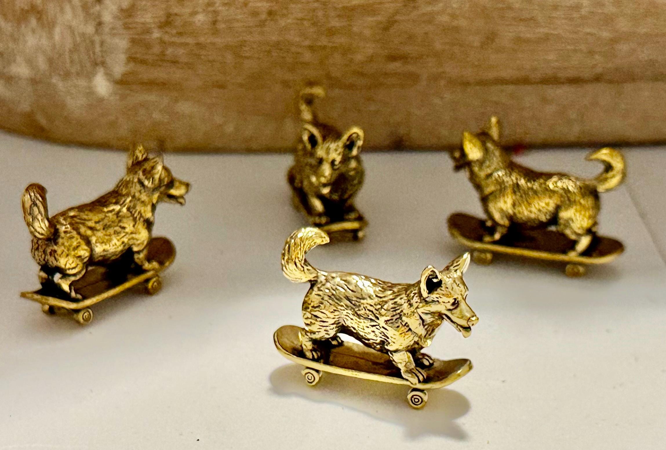 Miniature brass skateboarding Dog figurine