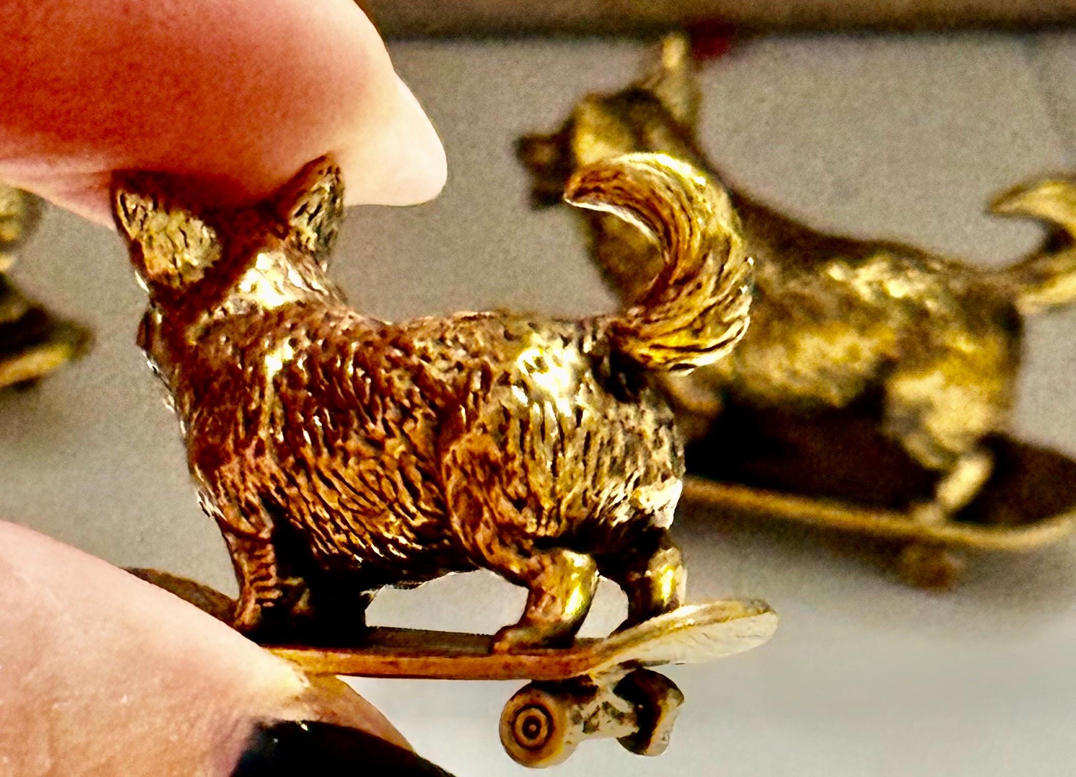 Miniature brass skateboarding Dog figurine