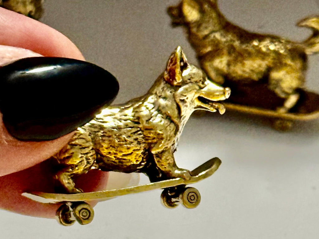 Miniature brass skateboarding Dog figurine