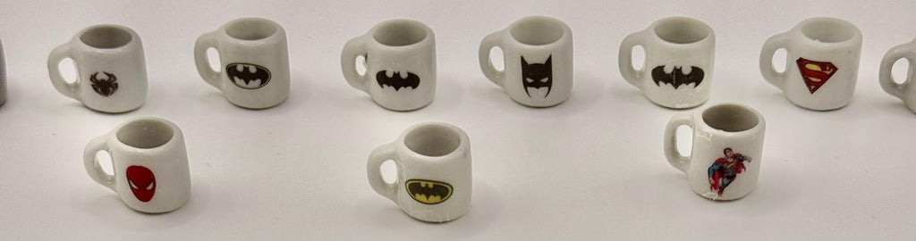 Miniature superhero coffee mugs